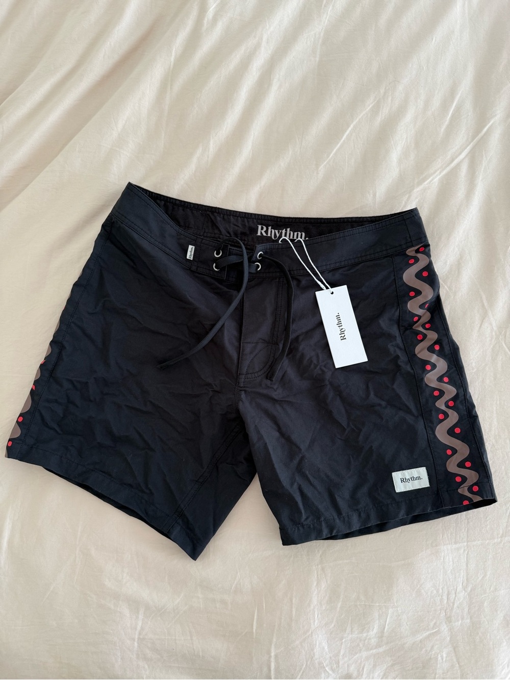 Rhythm. Heritage Black Swim Board Shorts with Red Wave Trim